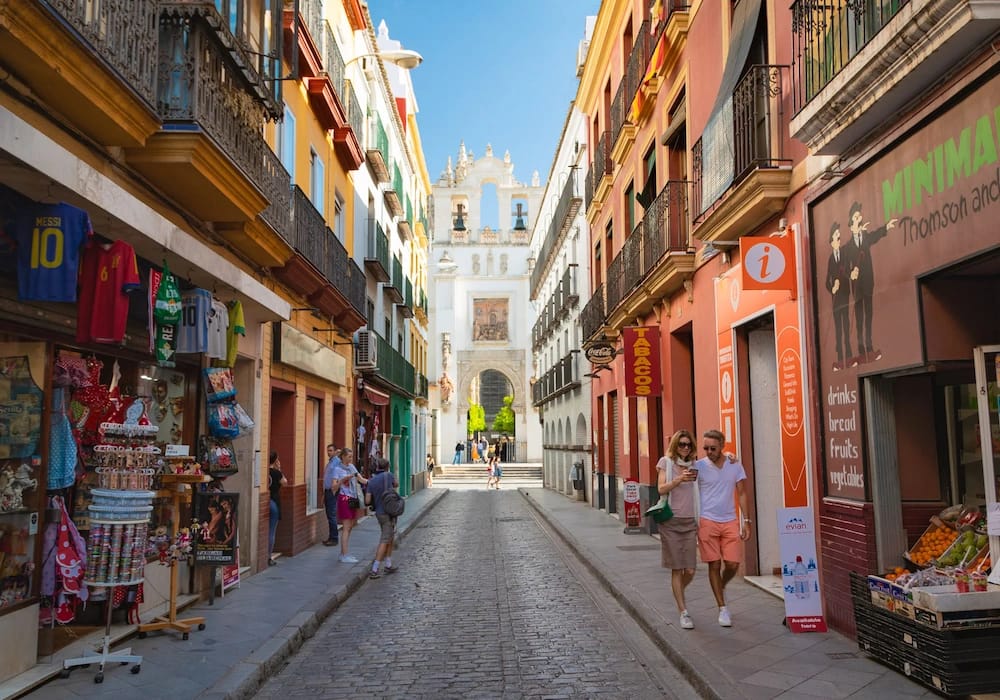 Santa Cruz Seville – colorful streets with whitewashed houses and flower-filled patios in the old Jewish quarter