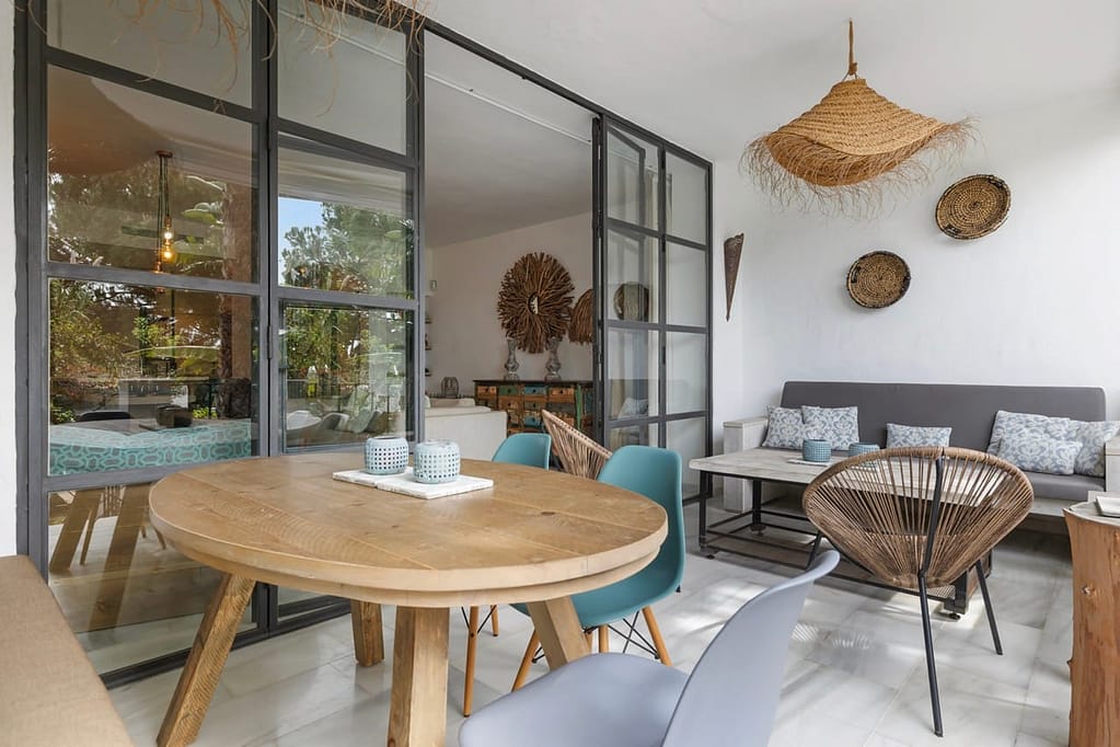 Terrace at Jardín de los Pinos holiday townhouse in Marbella, with dining area and garden view