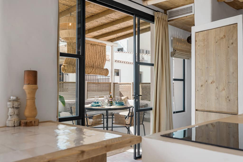 Open-plan living room and kitchen at Casa Aduar 22 Marbella Old Town